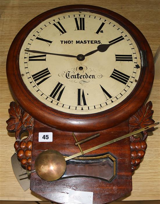 A railway clock, Thos Masters, with pendulum and key